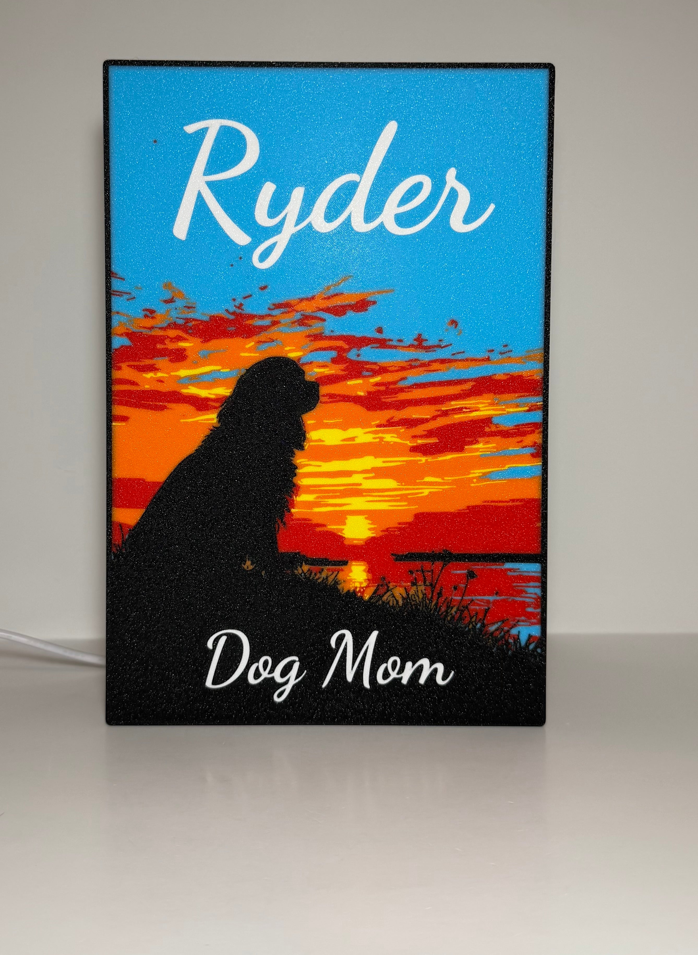 Custom pet memorial lightbox - close-up of dog silhouette with pink and orange sunset glow